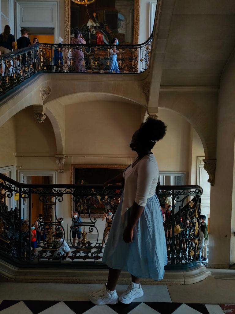 Martha inside the castle Versailles, the largest castle in France. This castle has the most famous room called the "Hall of Mirrors"